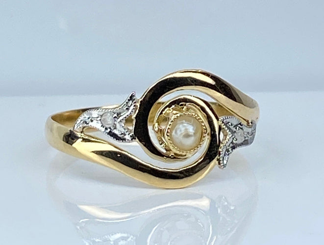 Bague 58 Bague en or jaune en perle et diamants sertis en or blanc 58 Facettes AB584