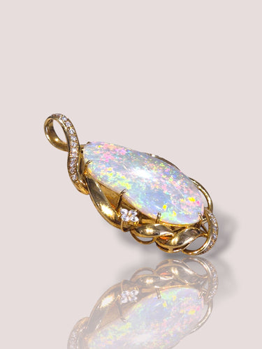 Pendentif Pendentif vintage en or jaune avec diamant et opale 58 Facettes 60023898