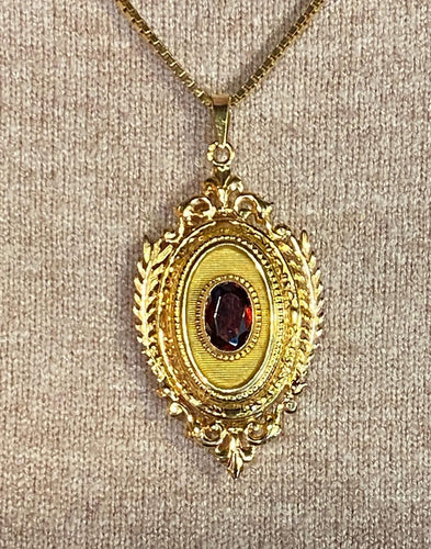 Pendentif Pendentif porte souvenir ouvrant en or et grenat 58 Facettes AB574