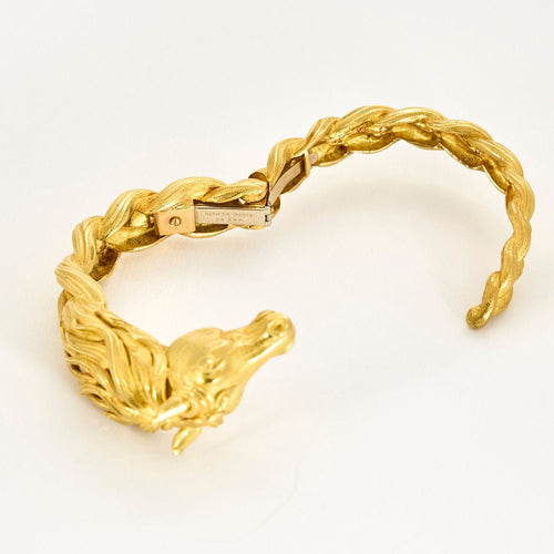 HERMES - Bracelet jonc en or jaune a motif de cheval