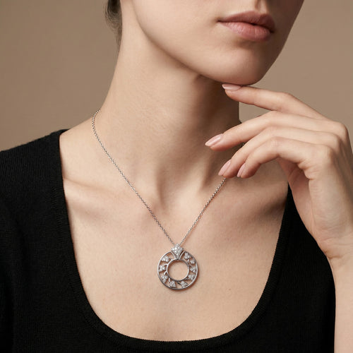 Pendentif Pendentif rond en or gris et diamants 58 Facettes 64700195