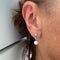 Boucles d'oreilles Boucles d’oreilles pendantes Art déco en or blanc 18 ct, perles et diamants 58 Facettes 23571