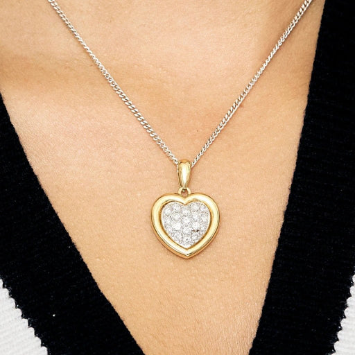 Pendentif Pendentif cœur en or jaune et gris et diamants 58 Facettes ROM1186