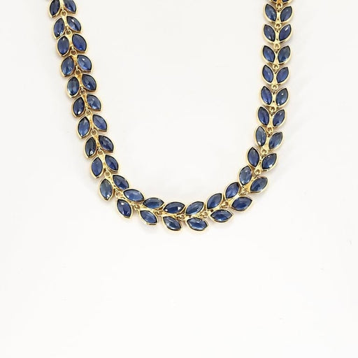 Collier Collier rivière à motif de feuilles en or jaune et saphirs 58 Facettes AUX1455
