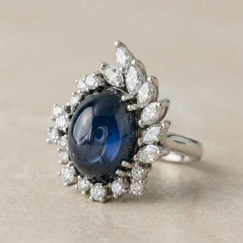 Bague 53.5 Bague en or blanc 750 avec saphir étoilé et diamants 58 Facettes 1864