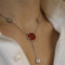 Collier Collier pendentif en or gris 18K avec spessartite cabochon et diamants 58 Facettes FB09339