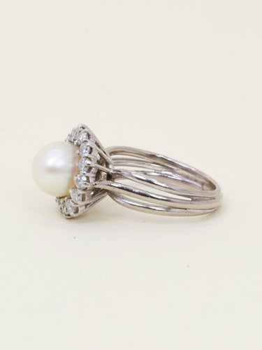 Bague 50 Bague marguerite vintage en or blanc 18 carats avec perle et diamants 58 Facettes 1186.3