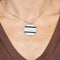 Collier CHAUMET - Chaîne en or blanc et pendentif en or blanc, diamants et émail noir 58 Facettes 250359