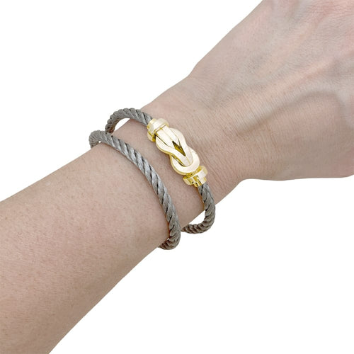 Bracelet Bracelet Fred, "Chance infinie", or rose et acier. 58 Facettes 35323