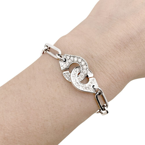 Bracelet Bracelet Dinh Van, "Menottes", or blanc et diamants. 58 Facettes 35224