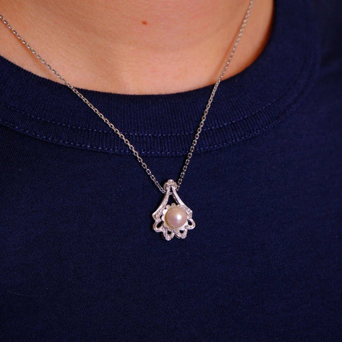 Pendentif Pendentif en or blanc et perle de culture 58 Facettes