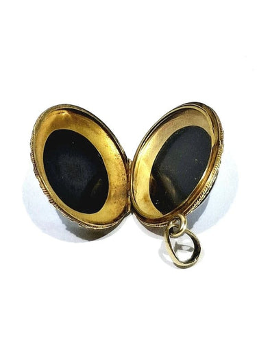 Pendentif Pendentif médaillon photo en or jaune 18 carats et onyx 58 Facettes 940723