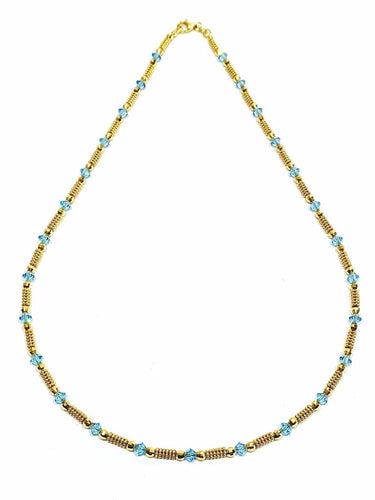 Collier Collier en or jaune 18 carats et perles de verre bleues 58 Facettes