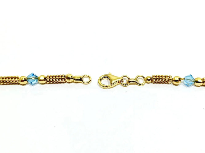 Collier Collier en or jaune 18 carats et perles de verre bleues 58 Facettes