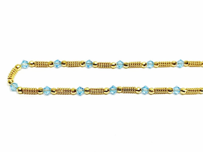 Collier Collier en or jaune 18 carats et perles de verre bleues 58 Facettes