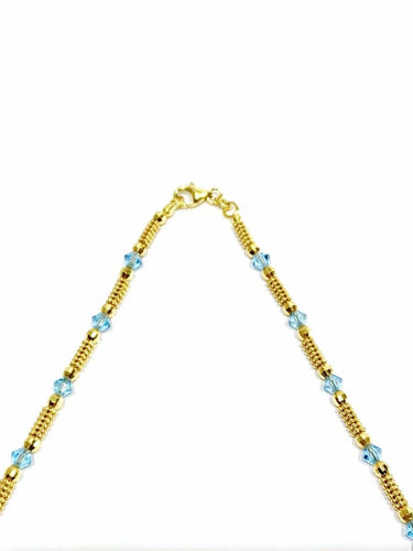 Collier Collier en or jaune 18 carats et perles de verre bleues 58 Facettes