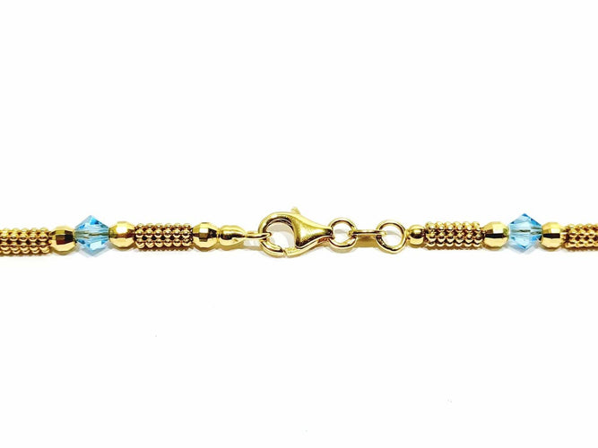 Collier Collier en or jaune 18 carats et perles de verre bleues 58 Facettes