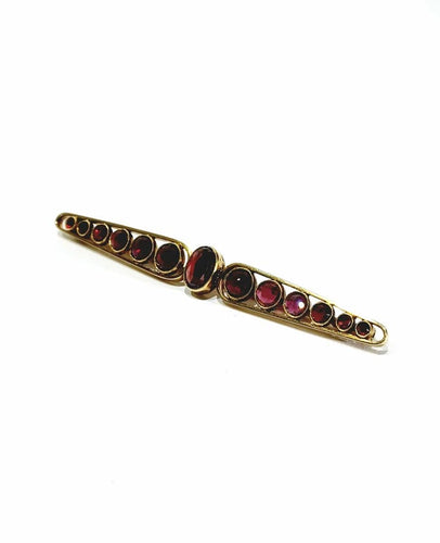 Broche Broche Art déco en or jaune 18 carats et grenats 58 Facettes