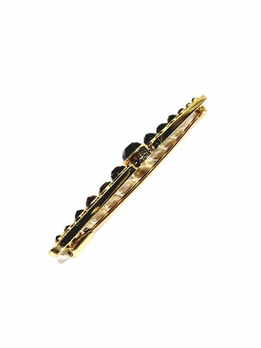 Broche Broche Art déco en or jaune 18 carats et grenats 58 Facettes