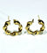 Boucles d'oreilles Créoles torsadées en or jaune 18 carats 58 Facettes