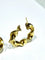 Boucles d'oreilles Créoles torsadées en or jaune 18 carats 58 Facettes