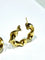 Boucles d'oreilles Créoles torsadées en or jaune 18 carats 58 Facettes