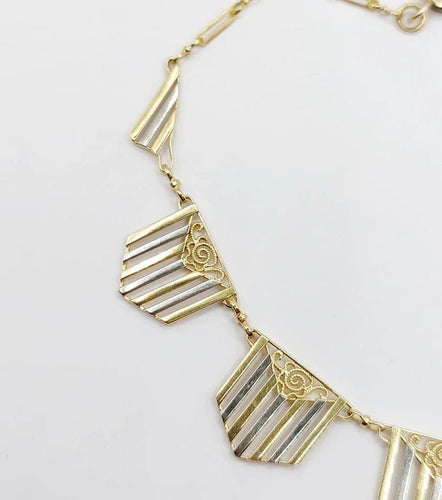Collier Collier Art déco à motifs filigranés en or jaune et blanc 18k 58 Facettes A04100
