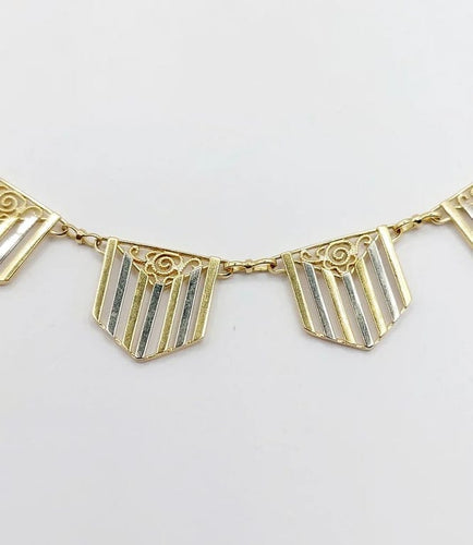 Collier Collier Art déco à motifs filigranés en or jaune et blanc 18k 58 Facettes A04100