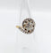 Bague 48 Bague tourbillon ancienne en or 18k et platine, diamants 58 Facettes A06630
