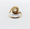 Bague 48 Bague tourbillon ancienne en or 18k et platine, diamants 58 Facettes A06630