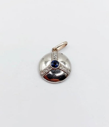 Pendentif Pendentif cible Art déco en or blanc 18k et platine, saphir synthétique et diamants 58 Facettes A06550