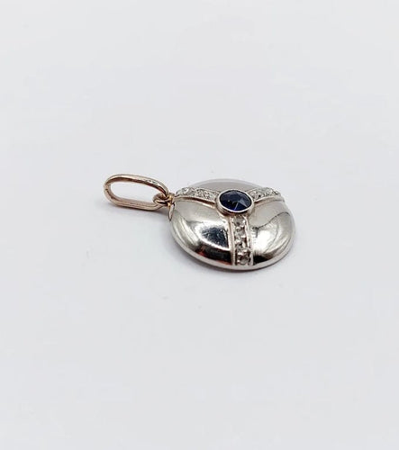 Pendentif Pendentif cible Art déco en or blanc 18k et platine, saphir synthétique et diamants 58 Facettes A06550