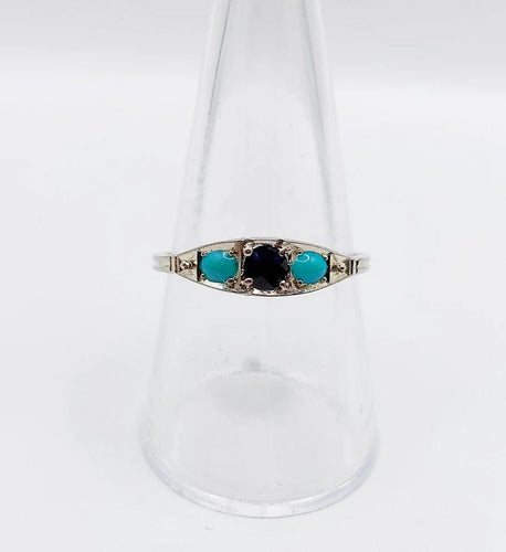 Bague 58 Bague jarretière Art déco en or blanc 18k, saphir et turquoises 58 Facettes A04043