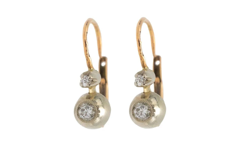 Boucles d'oreilles Boucles d'oreilles en or jaune et blanc avec diamants 58 Facettes 10190-4