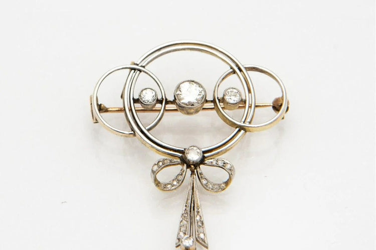 Broche Broche Art déco en or jaune, platine et diamants 58 Facettes 9456