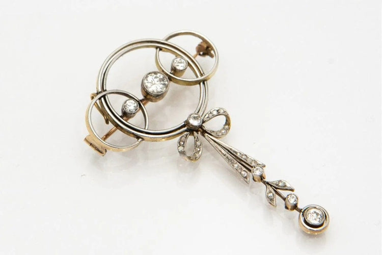Broche Broche Art déco en or jaune, platine et diamants 58 Facettes 9456