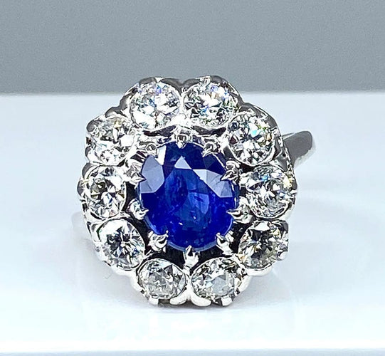 Bague 57 Bague marguerite en or blanc 18 carats et platine, saphir et diamants 58 Facettes AB347