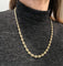 Collier Collier grain de café en or jaune 18K 58 Facettes