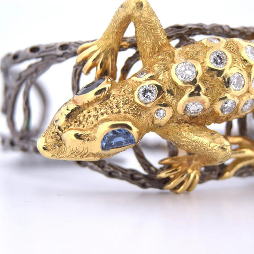 Bracelet Bracelet rigide motif gecko en or 18 carats, diamants et saphirs 58 Facettes BR113