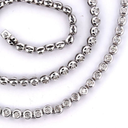 Collier Collier tennis en or blanc 18 carats et diamants 58 Facettes