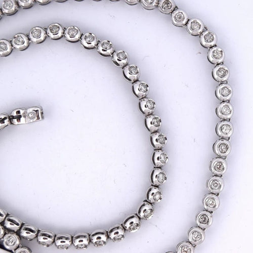 Collier Collier tennis en or blanc 18 carats et diamants 58 Facettes