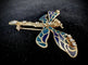 Broche Broche libellule en or jaune 14 carats, émail et diamants 58 Facettes