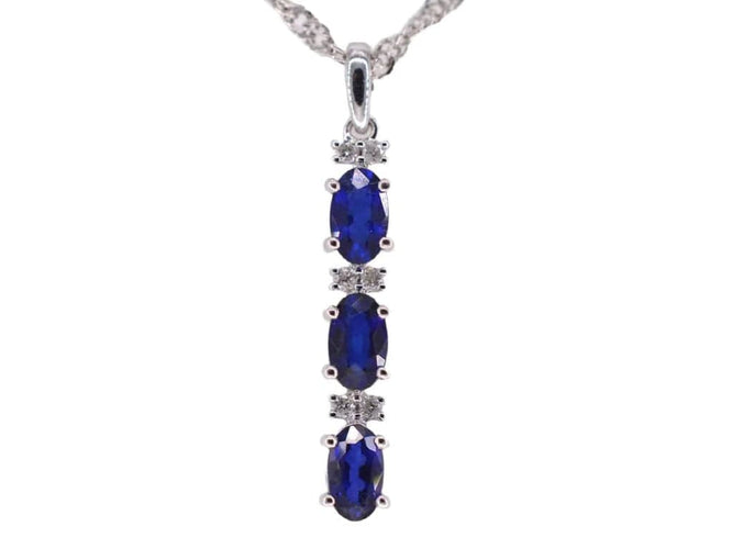Pendentif Pendentif en or blanc 14 carats avec diamants et saphir 58 Facettes 2136