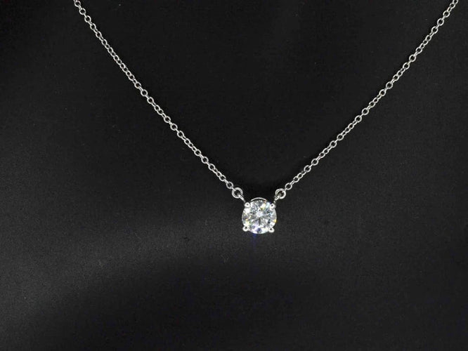 Collier Tiffany & Co - Collier solitaire en platine 950 et diamant 0,60 ct 58 Facettes 5194