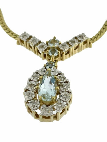 Collier Collier en or jaune et or blanc 14 carats, diamants et aigue-marine 58 Facettes