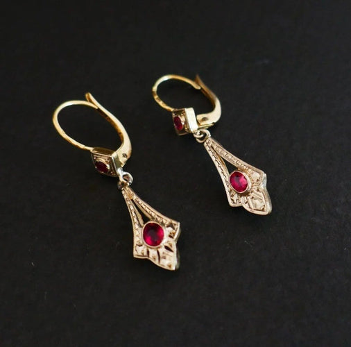 Boucles d'oreilles Boucles d’oreilles dormeuses en or 18 carats bicolore et pierres rouges 58 Facettes