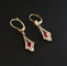 Boucles d'oreilles Boucles d’oreilles dormeuses en or 18 carats bicolore et pierres rouges 58 Facettes