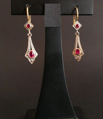 Boucles d'oreilles Boucles d’oreilles dormeuses en or 18 carats bicolore et pierres rouges 58 Facettes
