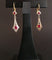 Boucles d'oreilles Boucles d’oreilles dormeuses en or 18 carats bicolore et pierres rouges 58 Facettes