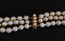 Collier Collier 3 rangs de perles de culture avec fermoir en or jaune 18 carats 58 Facettes